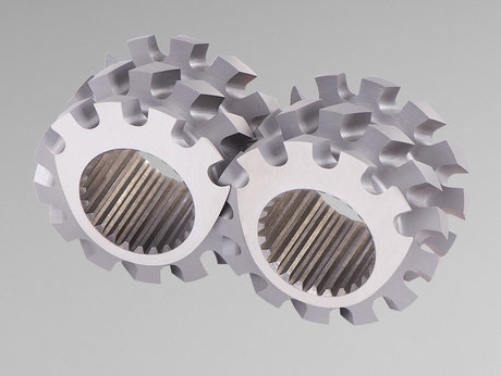 Zwei metallische Schneckenelemente mit Innenverzahnung als Verschleißteile für Extruder